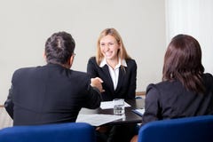 Female shaking hands at the job interview