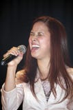 Female singer performing during a Christian concert in the Bronx. BRONX, NEW YORK - MARCH 17: Female singer performs during a Christian concert for Realizing Royalty Free Stock Photos Female singer performing during a Christian concert in the Bronx. BRONX, NEW YORK - MARCH 17: Female singer performs during a Christian concert for Realizing Royalty Free Stock Photos