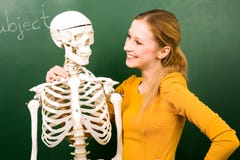 Female student with skeleton Stock Images Female student with skeleton Stock Images