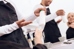 Female stylist show thumbs up to mature woman. Hairdresser recommend hair shampoo for woman. stock photo Female stylist show thumbs up to mature woman. Hairdresser recommend hair shampoo for woman. stock photo