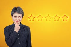 Female thinks of choosing five stars rating, positive feedback. Excellent customer service concept. Satisfied client voting survey