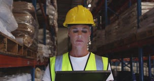Female warehouse worker patrolling warehouse corridor at night 4k stock video footage Female warehouse worker patrolling warehouse corridor at night 4k stock video footage