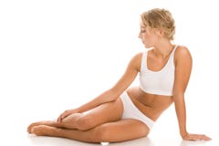 Femme s'asseyant sur le blanc photo stock Femme s'asseyant sur le blanc photo stock
