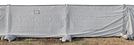 A fence of constrution site made of metal mesh and a white synt royalty free stock photography A fence of constrution site made of metal mesh and a white synt royalty free stock photography