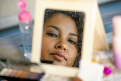 Lifestyle mirror reflection portrait of young happy and beautiful hispanic woman looking at herself after applying face makeup cos royalty free stock image Lifestyle mirror reflection portrait of young happy and beautiful hispanic woman looking at herself after applying face makeup cos royalty free stock image