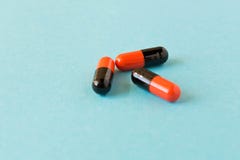 Few pills scattered on blue background . Birth control pills. Selective focus royalty free stock photo Few pills scattered on blue background . Birth control pills. Selective focus royalty free stock photo