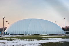 Field for football or tennis in the winter time. stretched awning for protection and protection from weather conditions - snow. royalty free stock photography Field for football or tennis in the winter time. stretched awning for protection and protection from weather conditions - snow. royalty free stock photography