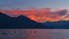 Fiery sky of red clouds at sunset on the lake stock photos Fiery sky of red clouds at sunset on the lake stock photos