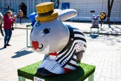 Figure of Easter bunny in a striped jacket with playing cards in his pocket and his glasses on the eyes. Beautiful Easter art deco stock photography Figure of Easter bunny in a striped jacket with playing cards in his pocket and his glasses on the eyes. Beautiful Easter art deco stock photography