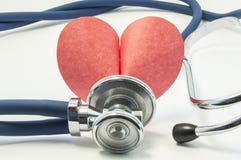 Figure or shape of human heart with stethoscope or phonendoscope around it on white background close up. Concept picture for medic royalty free stock photos Figure or shape of human heart with stethoscope or phonendoscope around it on white background close up. Concept picture for medic royalty free stock photos