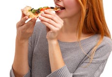 Fille assez jeune mangeant de la pizza savoureuse d'isolement sur un fond blanc Concept de nourriture photographie stock Fille assez jeune mangeant de la pizza savoureuse d'isolement sur un fond blanc Concept de nourriture photographie stock