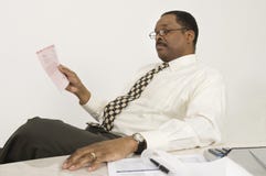 Financial Advisor Reading Document In Office Royalty Free Stock Photos Financial Advisor Reading Document In Office Royalty Free Stock Photos