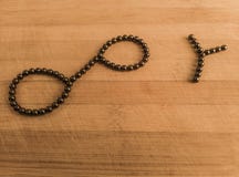 Financial Infinity Y symbol on wooden background stock photography Financial Infinity Y symbol on wooden background stock photography