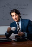 The financial specialist working late in the office stock image The financial specialist working late in the office stock image