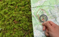 Finding The Right Position In The Forest With A Compass, Map An Royalty Free Stock Photo