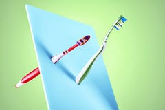 Fine art display of two new plastic toothbrushes Stock Photo Fine art display of two new plastic toothbrushes Stock Photo