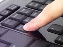 Finger pressing Delete button on the black keyboard stock images Finger pressing Delete button on the black keyboard stock images