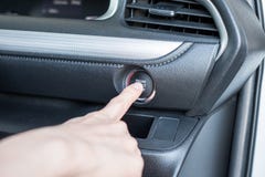 Finger pressing start engine car on control panel Stock Photos Finger pressing start engine car on control panel Stock Photos