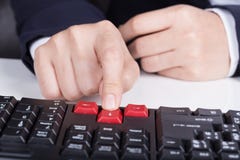 Finger pushing arrow button on keyboard computer stock photos Finger pushing arrow button on keyboard computer stock photos