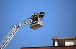 Firefighter team as they help the wounded with special stretcher royalty free stock images Firefighter team as they help the wounded with special stretcher royalty free stock images