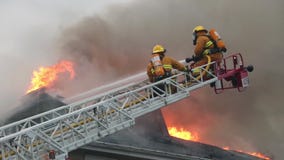 Firefighters battle blazing house fire
