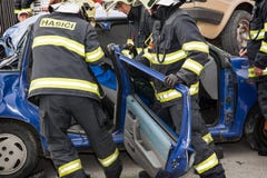 Firefighters Removing The Cutting Doors From A Car Wreck Royalty Free Stock Photo Firefighters Removing The Cutting Doors From A Car Wreck Royalty Free Stock Photo