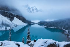 First Snow Morning At Moraine Lake In Banff National Park Alberta Canada Snow-covered Winter Mountain Lake In A Winter Atmosphere. Stock Image First Snow Morning At Moraine Lake In Banff National Park Alberta Canada Snow-covered Winter Mountain Lake In A Winter Atmosphere. Stock Image