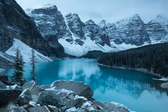 First Snow Morning At Moraine Lake In Banff National Park Alberta Canada Snow-covered Winter Mountain Lake In A Winter Atmosphere. Stock Photography First Snow Morning At Moraine Lake In Banff National Park Alberta Canada Snow-covered Winter Mountain Lake In A Winter Atmosphere. Stock Photography