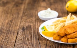 Fisch Sticks (close-up shot) on an old wooden table royalty free stock photos Fisch Sticks (close-up shot) on an old wooden table royalty free stock photos