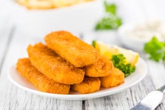 Fisch Sticks (close-up shot) on an old wooden table royalty free stock photo Fisch Sticks (close-up shot) on an old wooden table royalty free stock photo