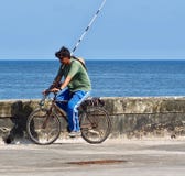 Fisherman On Bicycle In Cuba Stock Image Fisherman On Bicycle In Cuba Stock Image