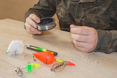 Fisherman prepare to fishing. Fishing tackle - fishing spinning, hooks and lures stock photos Fisherman prepare to fishing. Fishing tackle - fishing spinning, hooks and lures stock photos