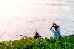 Fishermen are fishing on the boat in the river stock photo Fishermen are fishing on the boat in the river stock photo