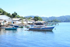 Fishermen houses and anchored boats on the sea Royalty Free Stock Photos Fishermen houses and anchored boats on the sea Royalty Free Stock Photos