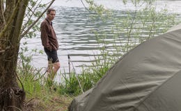 Fishing adventures, carp fishing and camping on lake royalty free stock photo Fishing adventures, carp fishing and camping on lake royalty free stock photo