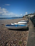 Boats pulled up onto the shore at Sidmouth in Devon. royalty free stock image Boats pulled up onto the shore at Sidmouth in Devon. royalty free stock image