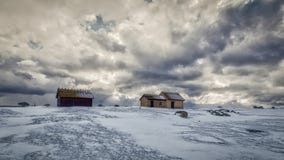 Fishing huts in winter with dramatic sky stock image Fishing huts in winter with dramatic sky stock image