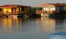 Fishing Lodges Near Sacca Scardovari In The River Delta Bit In The Province Of Rovigo In The Veneto (Italy) Fishing Lodges Near Sacca Scardovari In The River Delta Bit In The Province Of Rovigo In The Veneto (Italy)