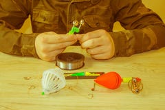 Fishing tackle - fishing spinning, fishing line, hooks and lures on the table royalty free stock photos Fishing tackle - fishing spinning, fishing line, hooks and lures on the table royalty free stock photos