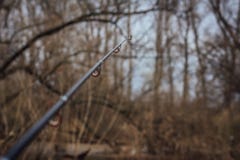 Fiskerulle och stång Selektivt fokusera Selektivt fokusera royaltyfri foto Fiskerulle och stång Selektivt fokusera Selektivt fokusera royaltyfri foto