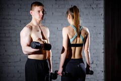 Fit couple lifting dumbbells together at the gym. stock images Fit couple lifting dumbbells together at the gym. stock images