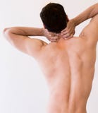 Fit healthy man holds his neck in pain stock image Fit healthy man holds his neck in pain stock image