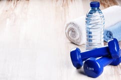 Fitness Concept With Dumbbells And Water Bottle Stock Photo Fitness Concept With Dumbbells And Water Bottle Stock Photo