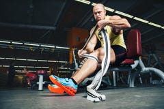 Fitness and Sport. Athletic man bodybuilder preparing for training. Stock Photo Fitness and Sport. Athletic man bodybuilder preparing for training. Stock Photo