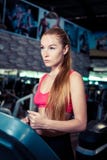 Fitness woman doing running exerciseon on a treadmill in the health club. stock photography Fitness woman doing running exerciseon on a treadmill in the health club. stock photography