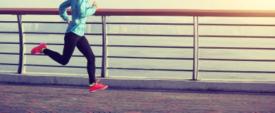 Fitness woman running on seaside royalty free stock photos Fitness woman running on seaside royalty free stock photos