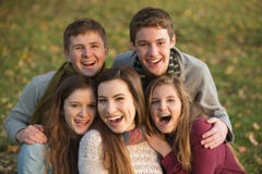 Five Laughing Teens Outdoors Royalty Free Stock Images
