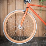 Fixed gear bicycle parked with wood wall, close up image Stock Photos Fixed gear bicycle parked with wood wall, close up image Stock Photos