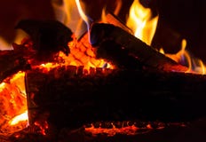 Flames orange red-hot log close-up background bonfire in the dark coals bright in the fireplace base design royalty free stock photos Flames orange red-hot log close-up background bonfire in the dark coals bright in the fireplace base design royalty free stock photos