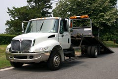 Flat Bed Tow Truck. Empty White Flat Bed tow truck Flat Bed Tow Truck. Empty White Flat Bed tow truck
